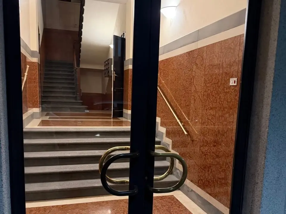 The entrance to The Moment in Bergamo — the door you open with your own link